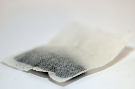 Isolated tea bag against white background with copy space