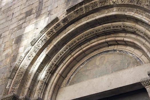 Stone archway over ancient cathedral