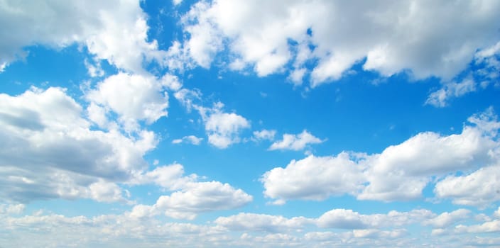 blue sky background with tiny clouds