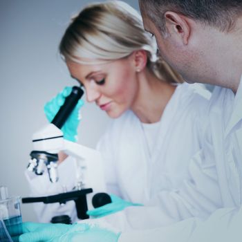  two scientist in chemical lab conducting experiments