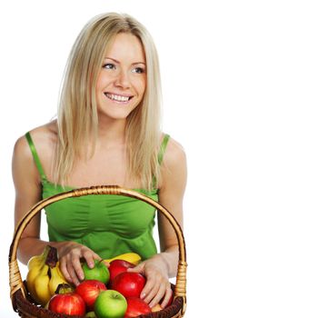 woman holds a basket of fruit on a white background