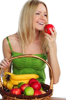 woman holds a basket of fruit on a white background