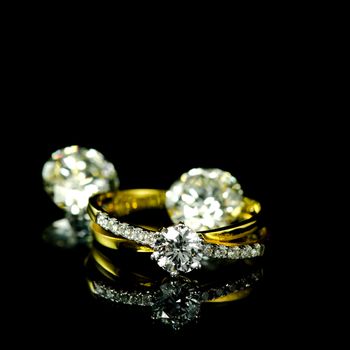 wedding diamond ring on black background