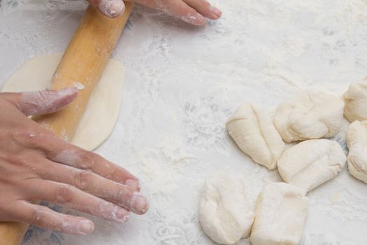 Flour in capacity with dough and rolling pin