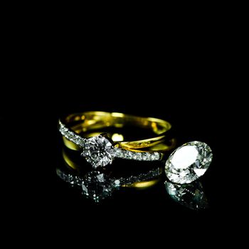 wedding diamond ring on black background