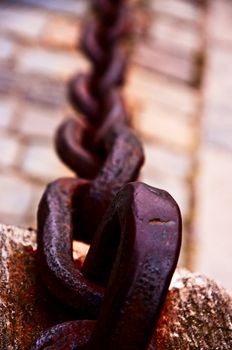 Old forged chain on quay  Stockholm  Sweden