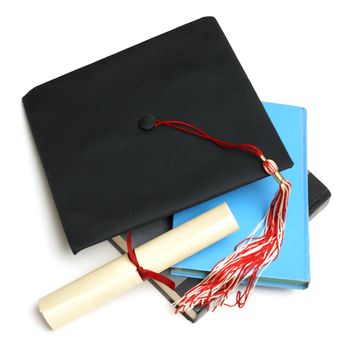 An isolated shot of a Grad hat and books from a high achieving student.