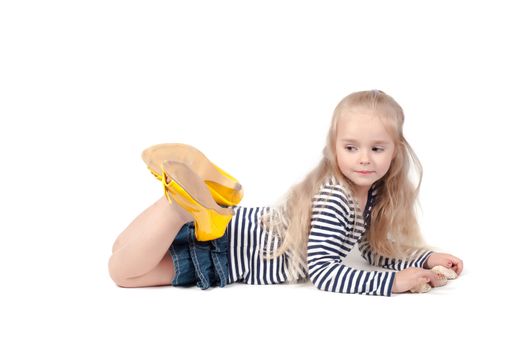 Shot of little cute with mother shoes in studio lies