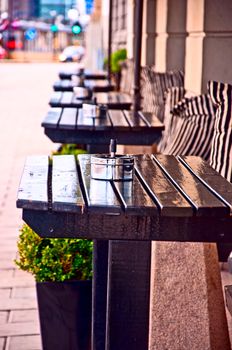 Typical generic outdoor cafe seating  Stockholm Sweden with tables and chairs on the sidewalk