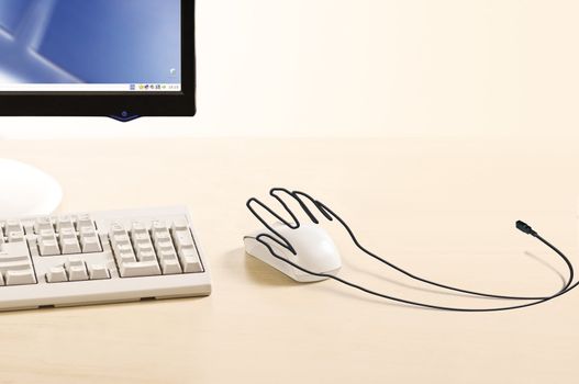 creative wire like hand on the mouse