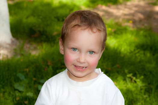 portrait of a young boy in nature