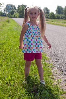 Little cute girl with long blond hair