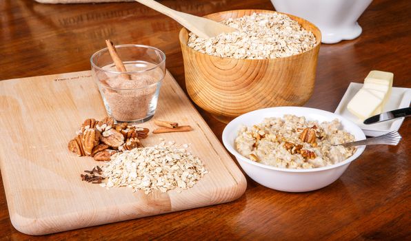 Ingredients on a table to prepare a hot bowl of oatmeal