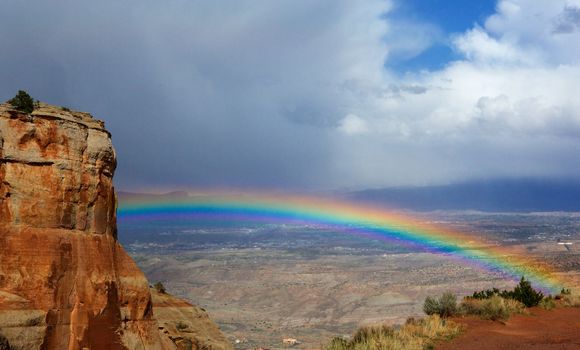 Bright rainbow over Grand Junction  Colorado from National Monument Park