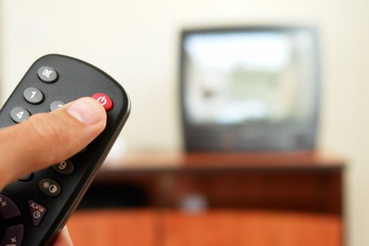 Television screen with tv remote control  in foreground.....