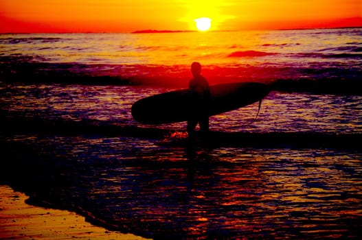 surfing at a nice beach outside at the sea