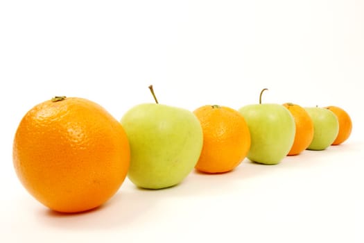 apple and oranges arranged to symbolize leadership, teamwork, network, discrimination............