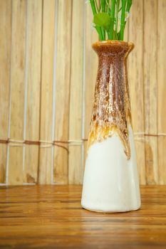 Brown vase on the old wood background