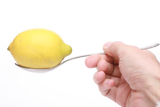 a spoon with a lemon on it as a symbol for taking vitamins...........