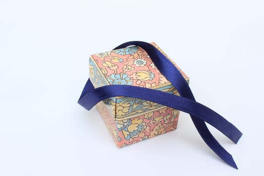 image of blue bow on colored gift box 