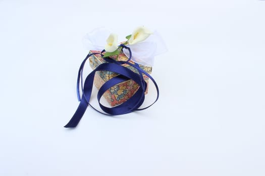 fine image of nice gift box with decorative flowers and bow