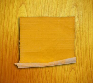 piece of corrugated cardboard on the wood background