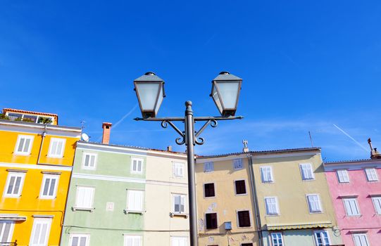 old lamp on the color of houses