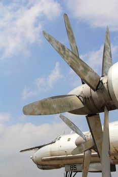 Strategic bomber propeller engine  against  cloudy sky background