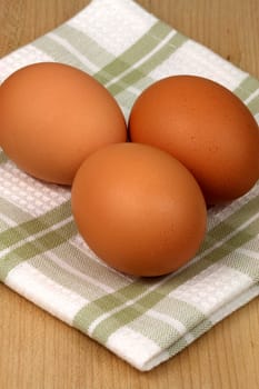 raw eggs on fancy kitchen napkin, one of the most used food ingredient