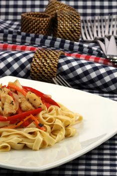 Gourmet exquisite halibut  fettuccine pasta  on fancy dinner plate   