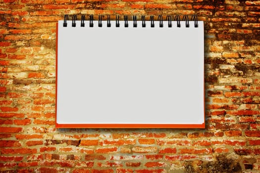 notebook on the brickwall