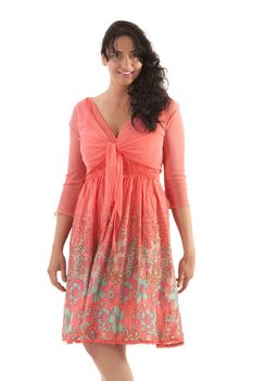 Black-haired woman in a salmon-colored summer dress