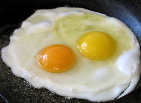 frying eggs on frying pan