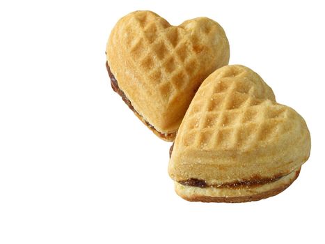 two heart-shaped biscuits over white