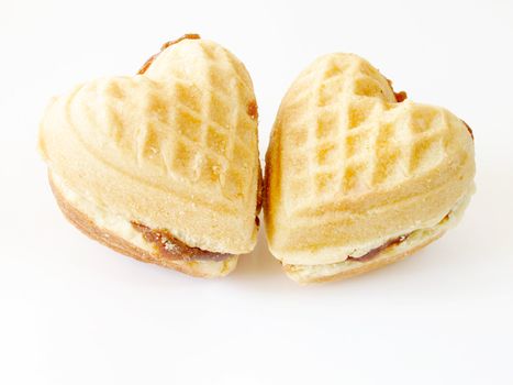 two heart-shaped biscuits over white