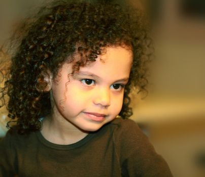 a cute little mixed race child portrait look of innocence