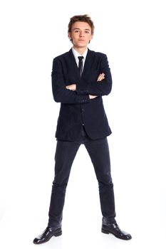 Teenage boy in a business suit. Isolated on white background.