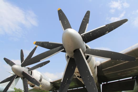 Strategic bomber propeller engine  against  cloudy sky background