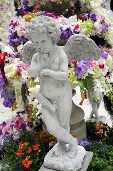 Statue of Cupid in a Garden 