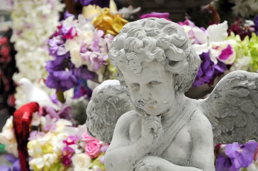 Statue of Cupid in a Garden 