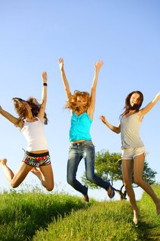 fun smile girlfriends jump to sky