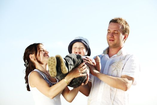 happy family on blue sky background