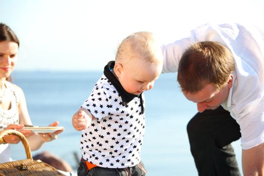 picnic of happy family near sea