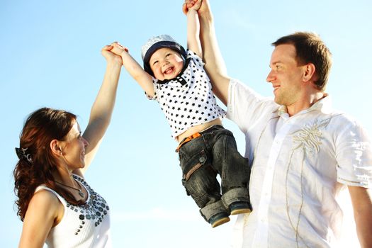 happy family on blue sky background