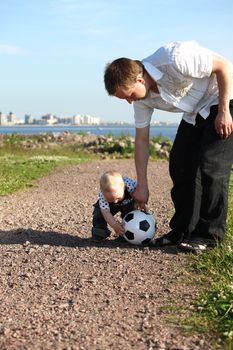 father and son play in soccer