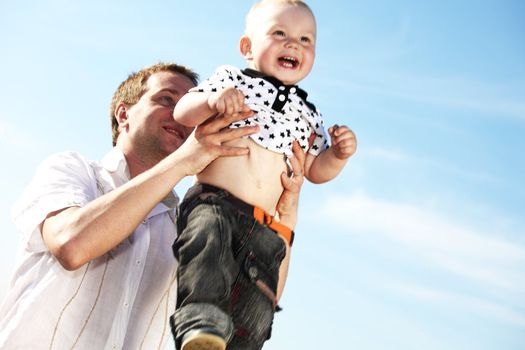 father and take son in blue sky