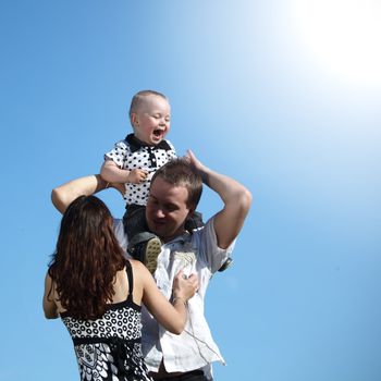 happy family on blue sky background