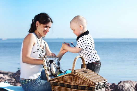 picnic of happy family near sea