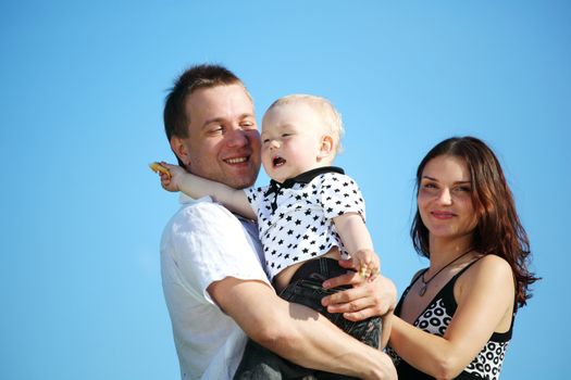 happy family on blue sky background