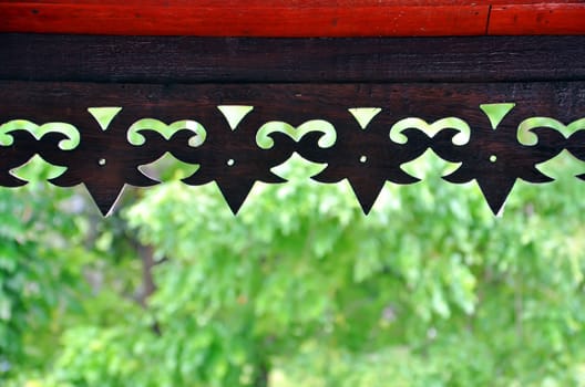 Thai style wood carving on roof